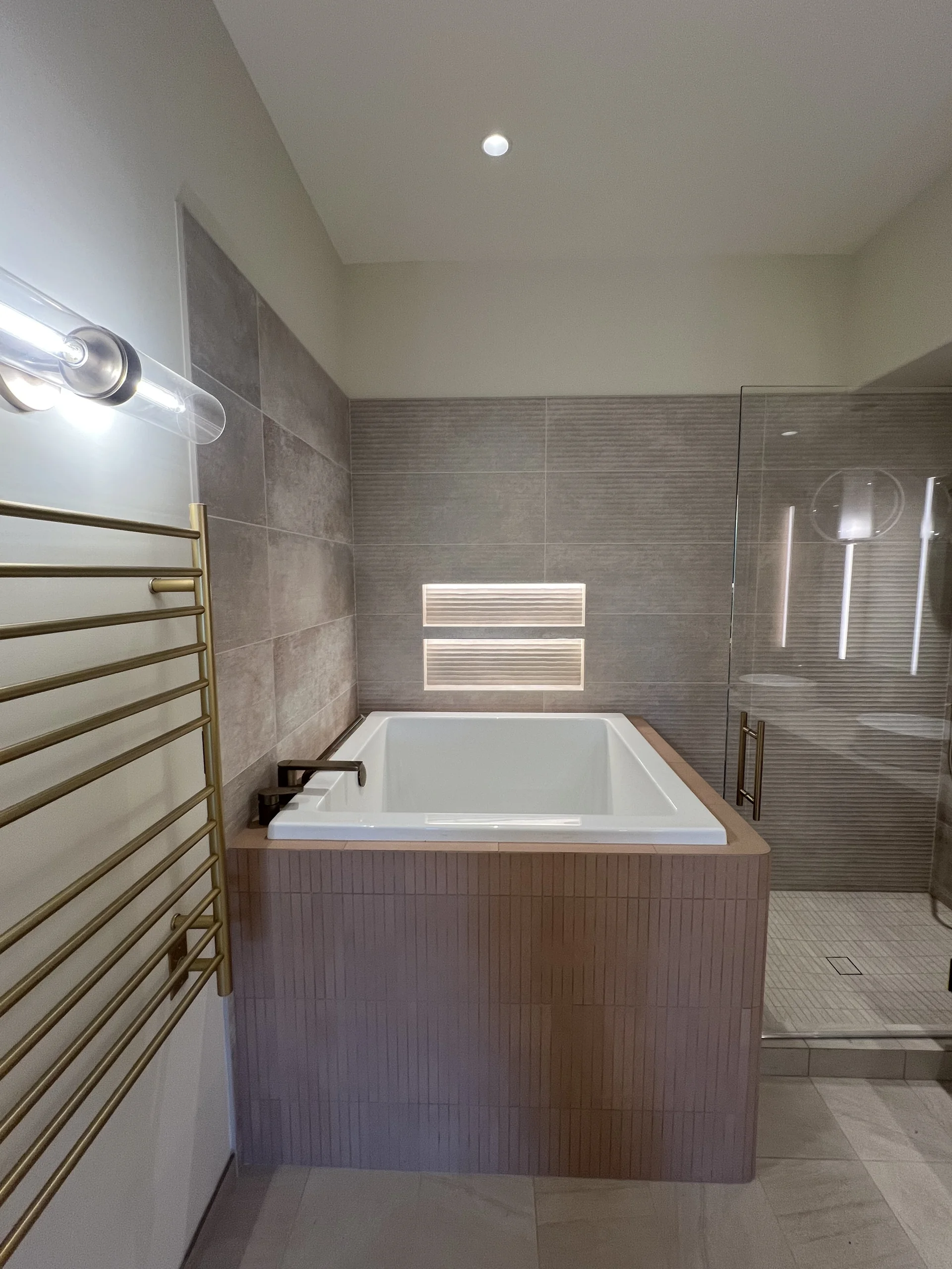 Bay Valley Electric bathroom lighting with recessed ceiling light, illuminated shower niche and vanity fixture